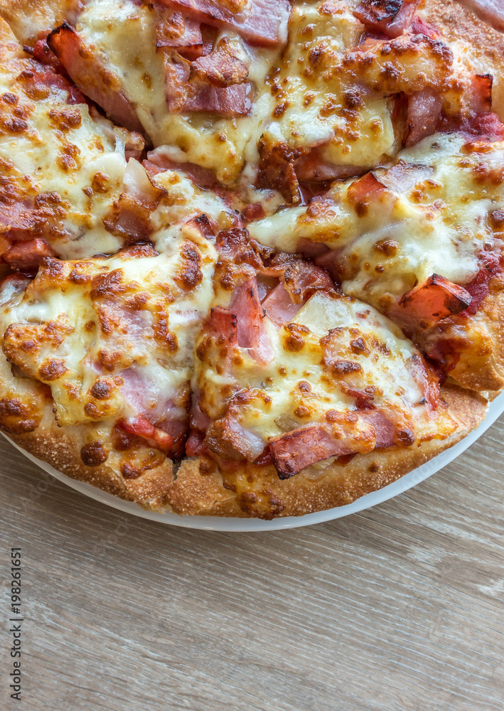 Delicious italian pizza served on wooden table Delicious italian pizza served on wooden table