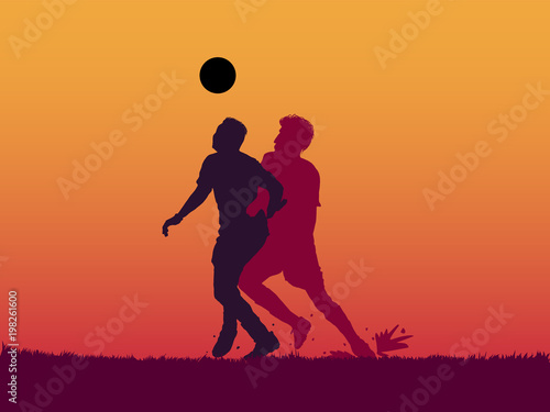 silhouette of soccer player jumping to head the ball