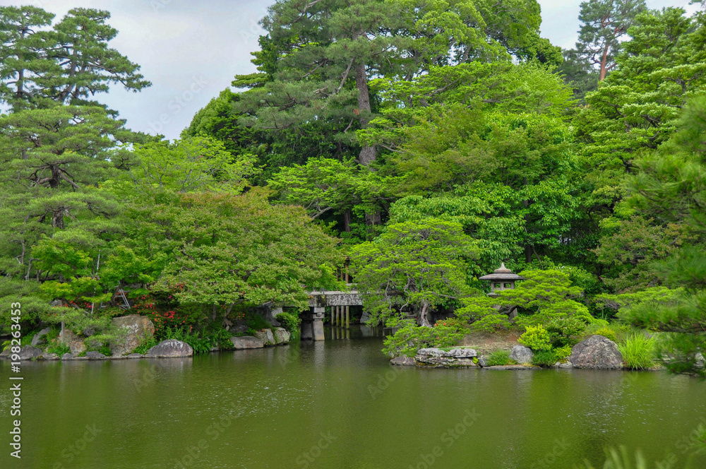 Traditional Japanese garden with a pond at the grounds of the old Imperial Palace in Nara, Japan