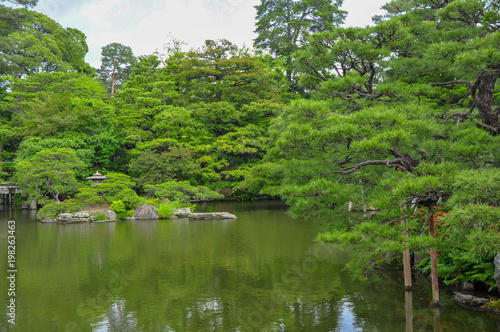 Traditional Japanese garden with a pond at the grounds of the old Imperial Palace in Nara, Japan