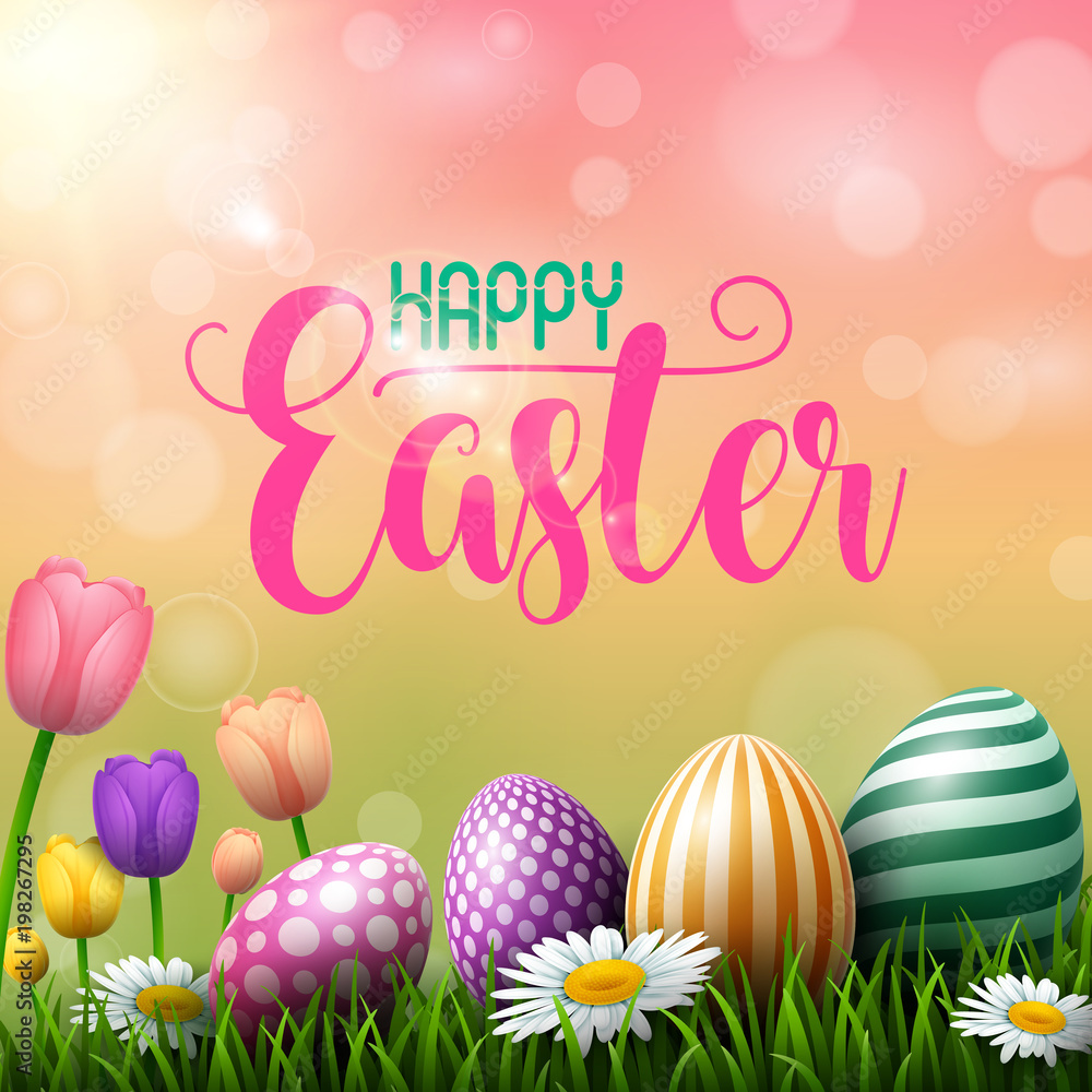 Happy Easter eggs with tulips flower on meadow background