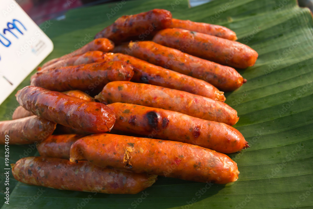 Hot Dogs or SAI AUA ((Notrhern Thai Spicy Sausage) on banana leaf
Hot Dogs or SAI AUA ((Notrhern Thai Spicy Sausage) on banana leaf