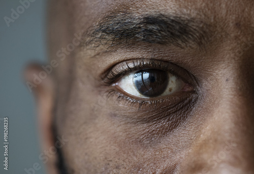 Closeup of an eye of a black man photo
