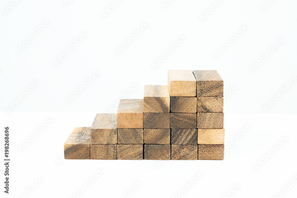 Obraz premium Wood block stacking, Stepping up a toy wood staircase.