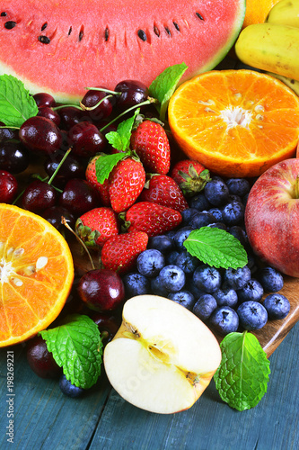 Fresh fruits on wooden background  Healthy diet.