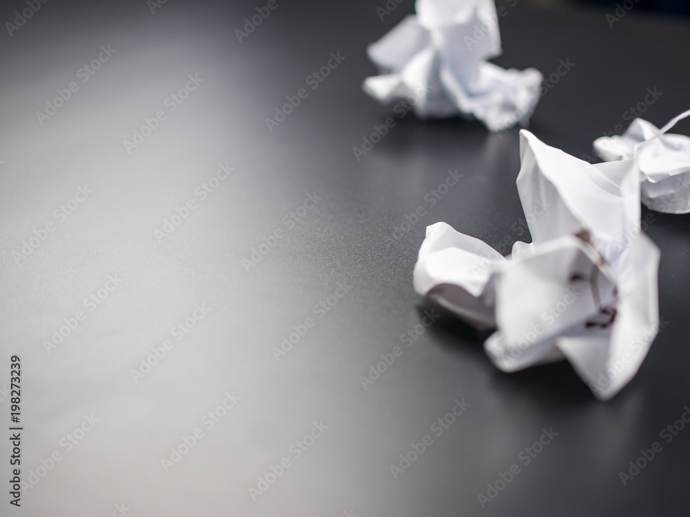Crumpled paper balls on black background Crumpled paper balls on black background