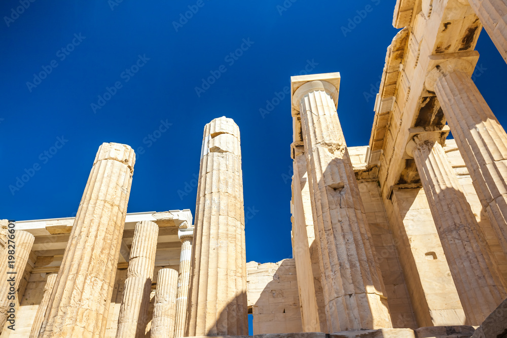 Looking up at a columns of Propylaea gateway in Acropolis of Athens, Greece