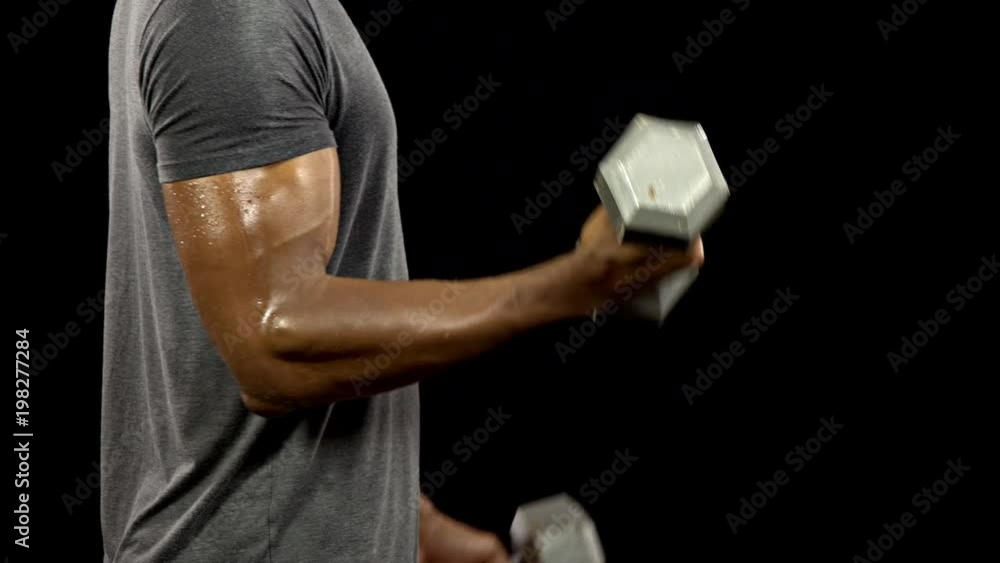 Athletic Man working out. Lifting Weights. Athletic Man working out. Lifting Weights.