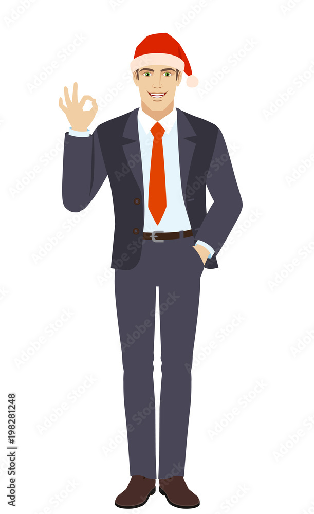 OK! Businessman in Santa hat showing a okay hand sign OK! Businessman in Santa hat showing a okay hand sign