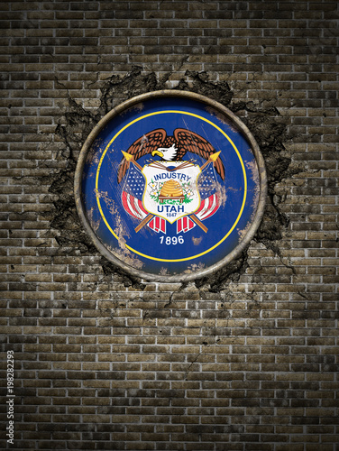 Old Utah flag in brick wall photo