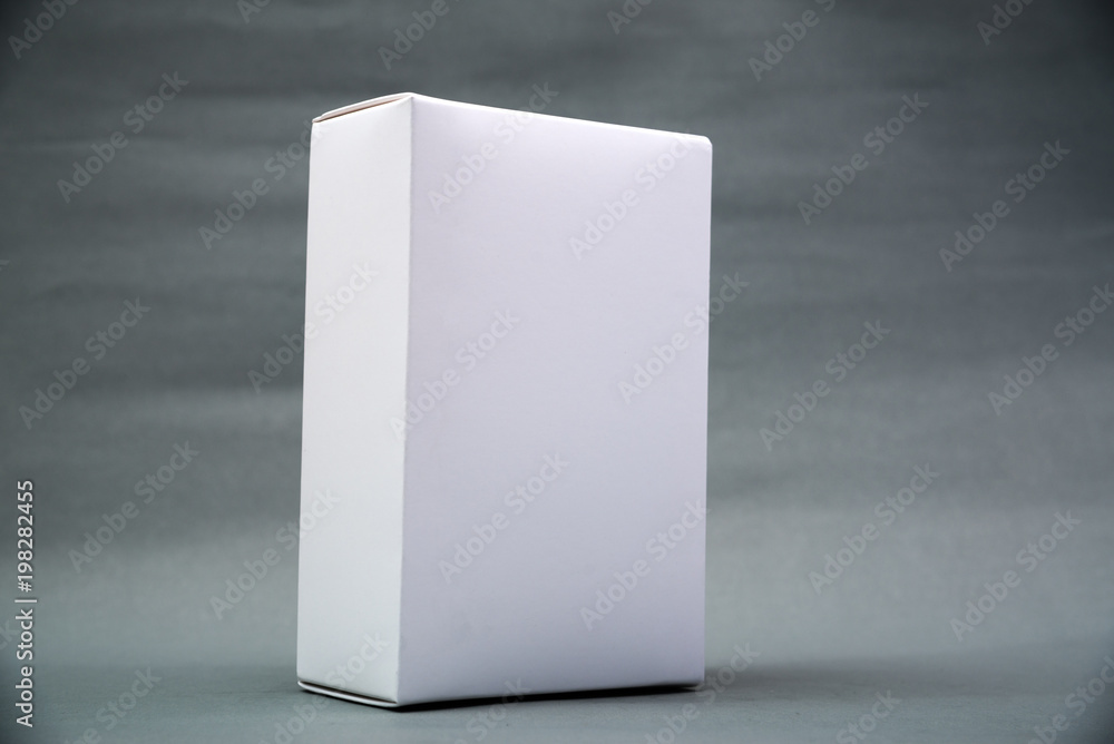 Empty Package white cardboard box or tray for product on grey background. Empty Package white cardboard box or tray for product on grey background.
