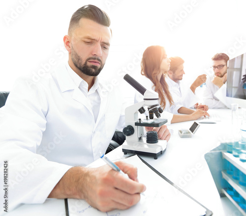 young scientist works in the lab.