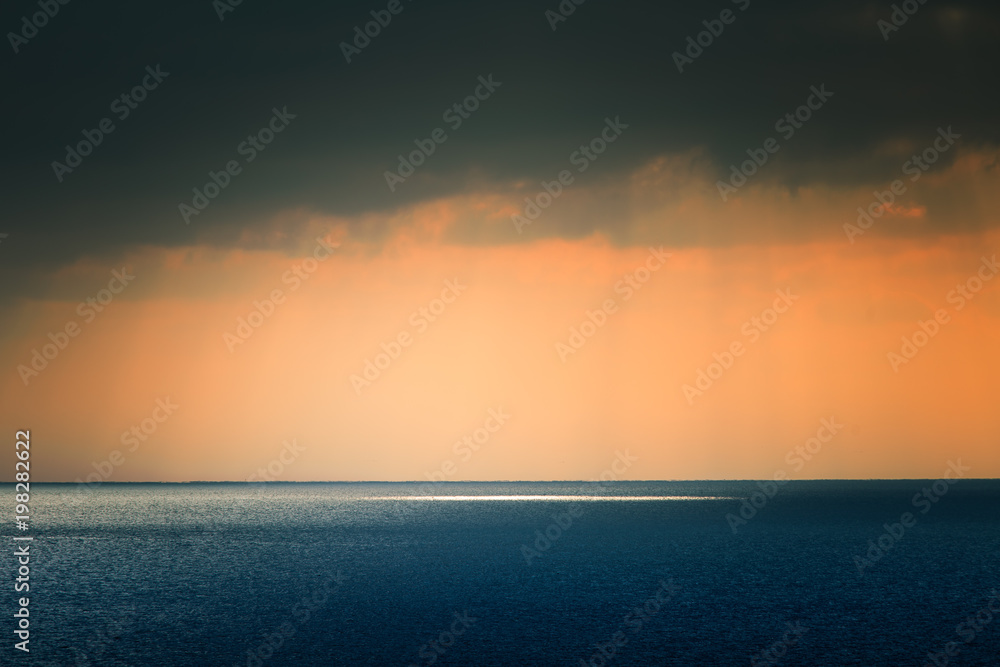 Obraz premium A beautiful landscape of a sea in winter evening. Baltic sea at the sunset. Vivid colors.