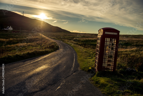Photos A lone telephone box stands on a road in the Scottish highlands