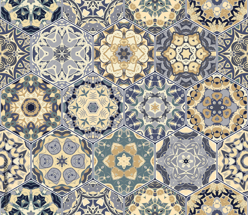 Bright seamless pattern of hexagonal tiles with vintage ornament. Colorful vector set of elements for design of wallpaper, fabric or wrapping paper.