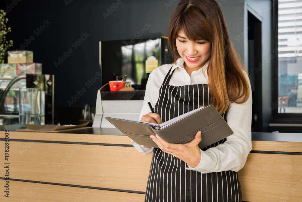 business owner holding notebook standing in front of the coffee shop with a smile, owners business business owner holding notebook standing in front of the coffee shop with a smile, owners business