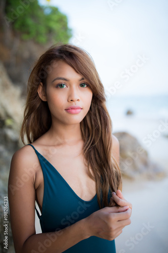 Young beautiful girl enjoying her day at the beach. 