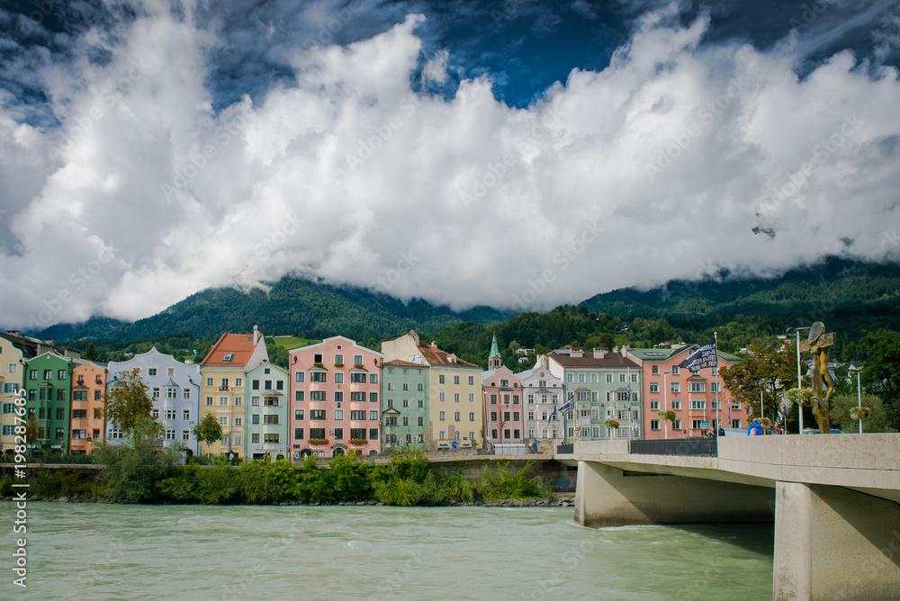 Multi-colored houses by the river bank. Innsbruck, Austria
