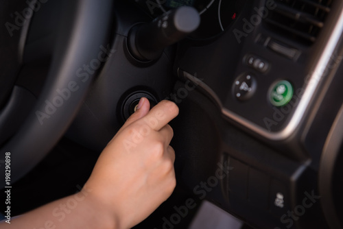 Close-up portrat of woman hand inserting key to turn on/off car engine © Maha Heang 245789