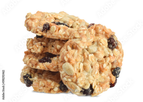 Caramel cookies with cereals isolated on white