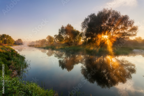 Reflection of a beautiful dawn sky in a river