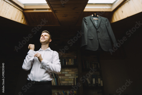 Wallpaper Mural the groom adjusts his jacket, groom in a jacket, The morning of  Torontodigital.ca