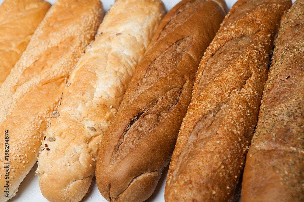 fresh baguettes on the wooden background