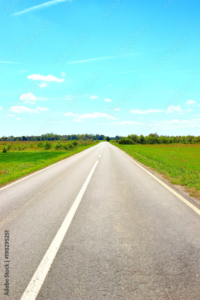 Empty road direction, blue sky in background Empty road direction, blue sky in background