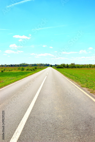 Empty road direction, blue sky in background