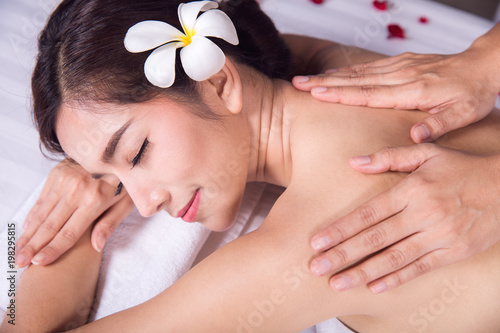 Asian lady relax with masage and spa in resort, this photo can use for skin care, spa, massage, healthy, holiday and relax concept