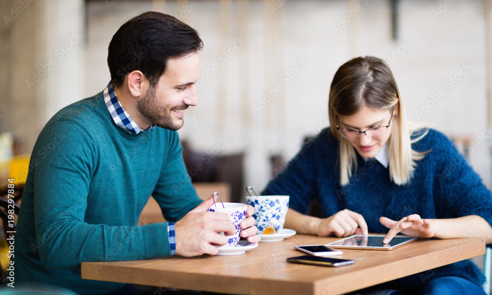 Young attractive couple on date in coffee shop Young attractive couple on date in coffee shop