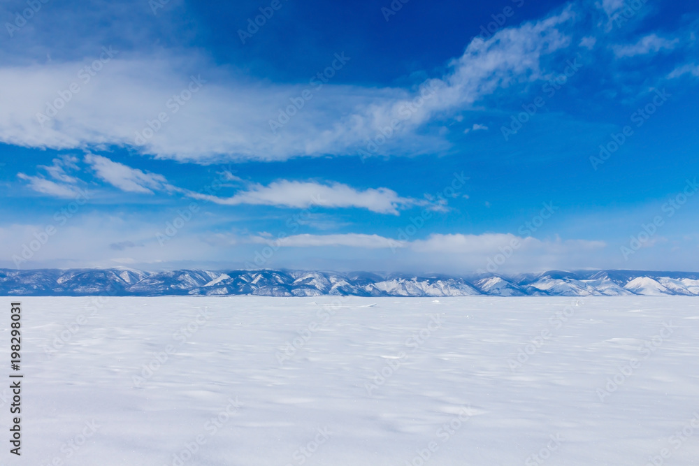 Winter landscape. Beautiful view of the snow-capped mountains in Lake Baikal