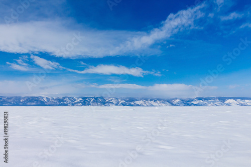 Winter landscape. Beautiful view of the snow-capped mountains in Lake Baikal