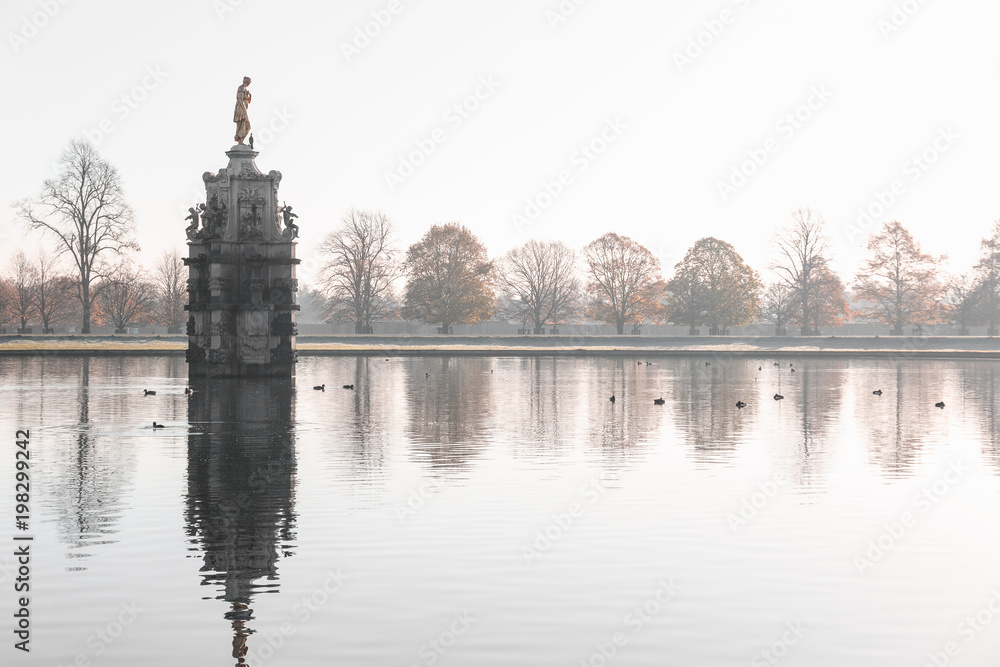 Diana fountain, early morning misty scene at Bushy Park in London