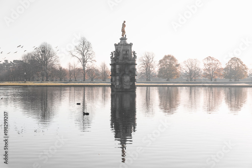 Diana fountain  early morning misty scene at Bushy Park in London