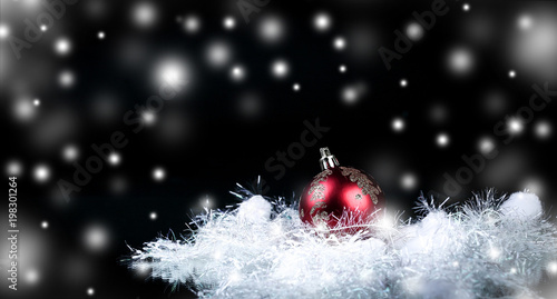 beautiful red Christmas ball on a black background.