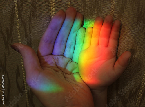 hand of mother and child rainbow