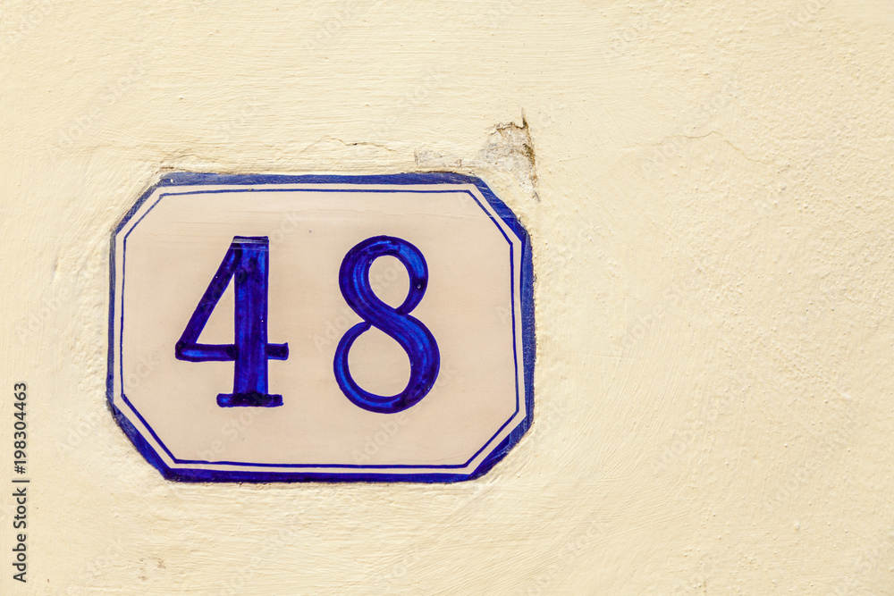numerical tile on a stone wall background numerical tile on a stone wall background