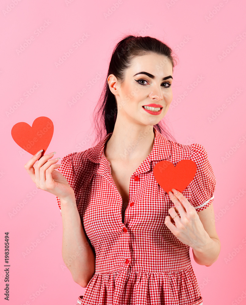 Woman in stylish dress holds romantic symbols. Fall in love. Woman in stylish dress holds romantic symbols. Fall in love.