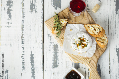 Baked camembert with toasts and thyme photo