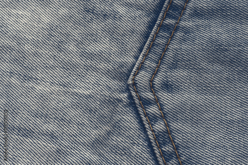 a large seam in the form of an arrow on a denim blue fabric