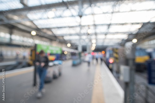 Blurred image bokeh of People walking around Edinburgh Waverley, the main Train Station in Edinburgh, United Kingdom