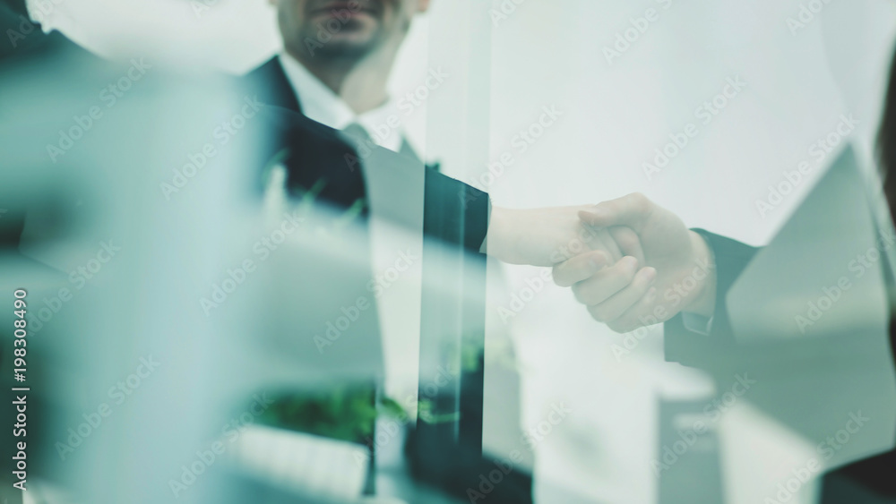 concept of reliability and partnership: a handshake of business concept of reliability and partnership: a handshake of business