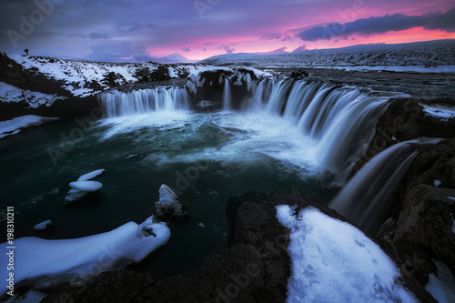 Photographer take a photo at godafoss waterfall