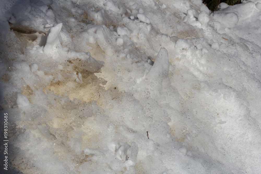 Fototapeta premium Texture of melting snow, ice crystals close-up. Abstract background