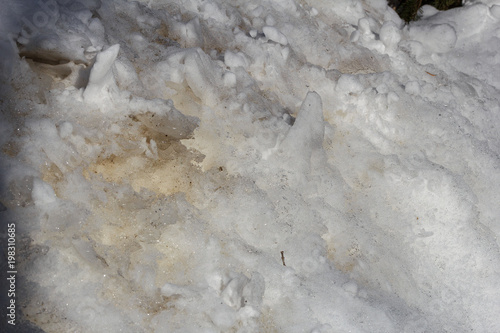 Texture of melting snow, ice crystals close-up. Abstract background © Olga Soloveva