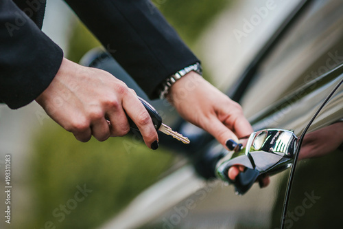 business lady holds car s key in her hand
