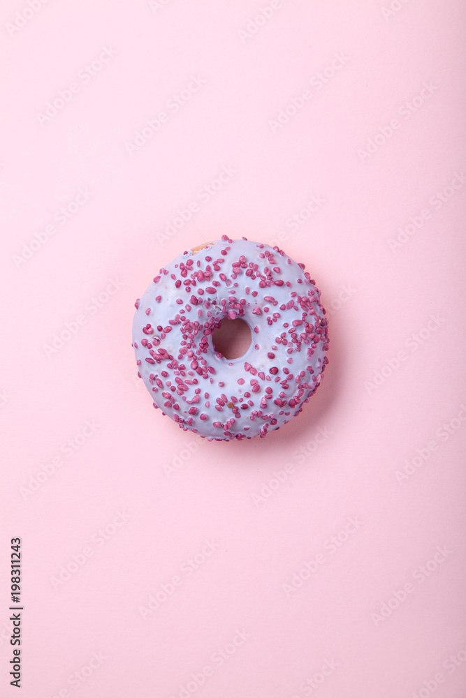 Sweet glazed raspbrery donut on pink background Sweet glazed raspbrery donut on pink background