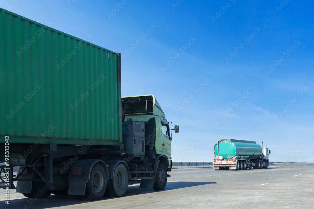 Truck on highway road with container, transportation concept.,import,export logistic industrial Transporting Land transport on the asphalt expressway with blue sky Truck on highway road with container, transportation concept.,import,export logistic industrial Transporting Land transport on the asphalt expressway with blue sky