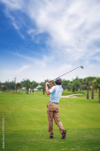 Asian Golf player on tee off green